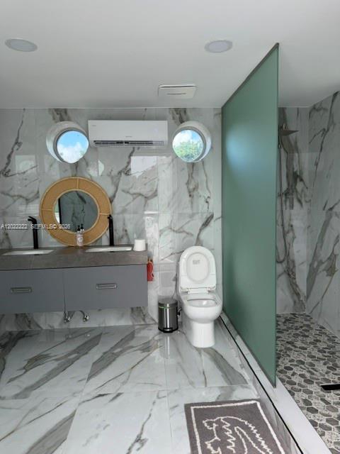 20465 Southwest 200th Street Miami, FL 33187 - Photo 11 of 36 a bathroom with a toilet sink and mirror