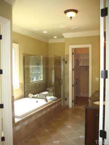 2718 Anderson Drive Raleigh, NC 27608 - Photo 9 of 12 a view of bathroom with a tub shower and sink