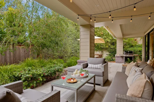 a outdoor living space with furniture and garden view
