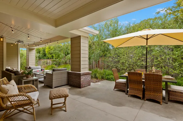 a outdoor space with patio the couches and a umbrella