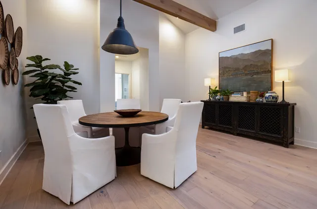 a dining room with furniture and window