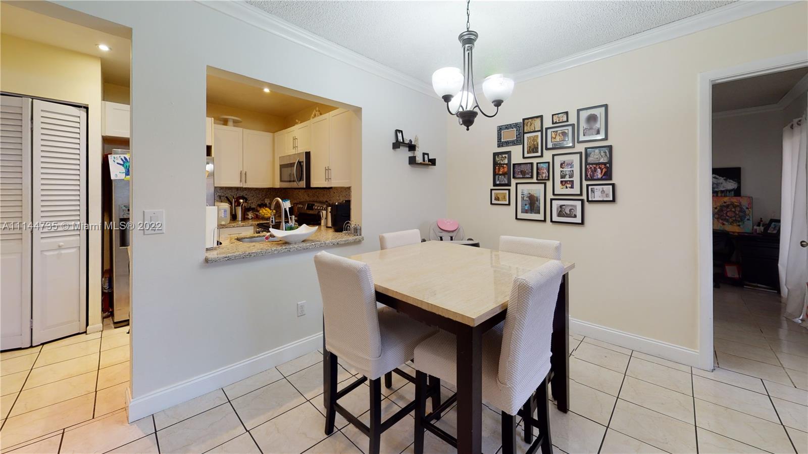14911 Southwest 104th Street, Unit 1722 Miami, FL 33196 - Photo 12 of 29 a view of a dining room with furniture