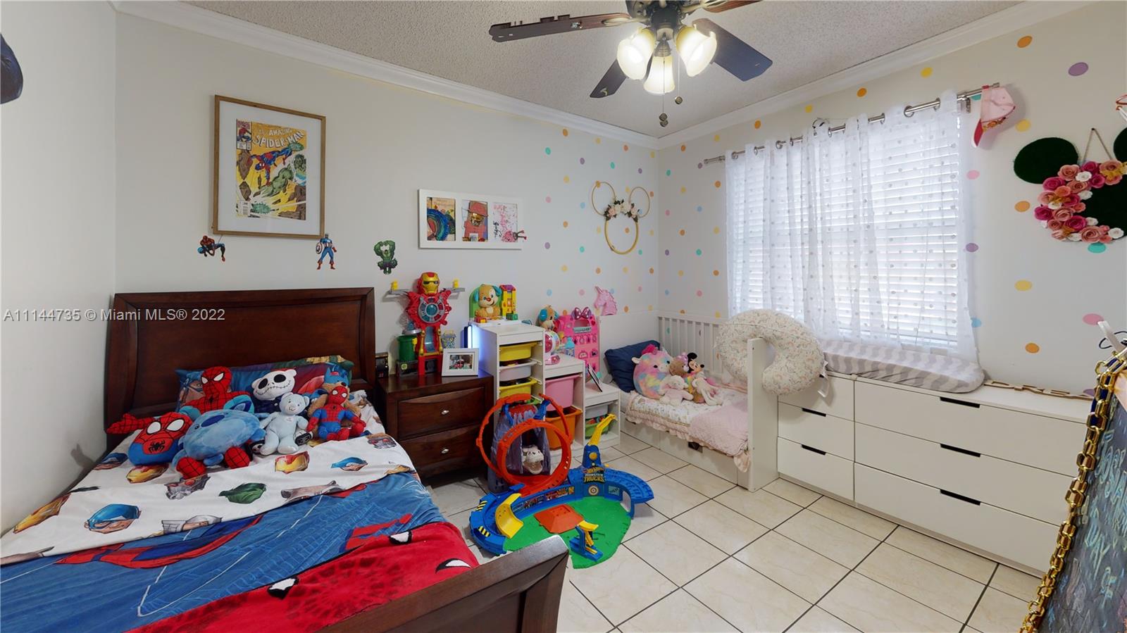 14911 Southwest 104th Street, Unit 1722 Miami, FL 33196 - Photo 25 of 29 a bedroom with furniture and a baby crib