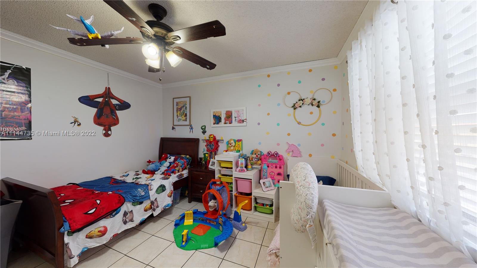 14911 Southwest 104th Street, Unit 1722 Miami, FL 33196 - Photo 26 of 29 a bedroom with furniture and a chandelier fan