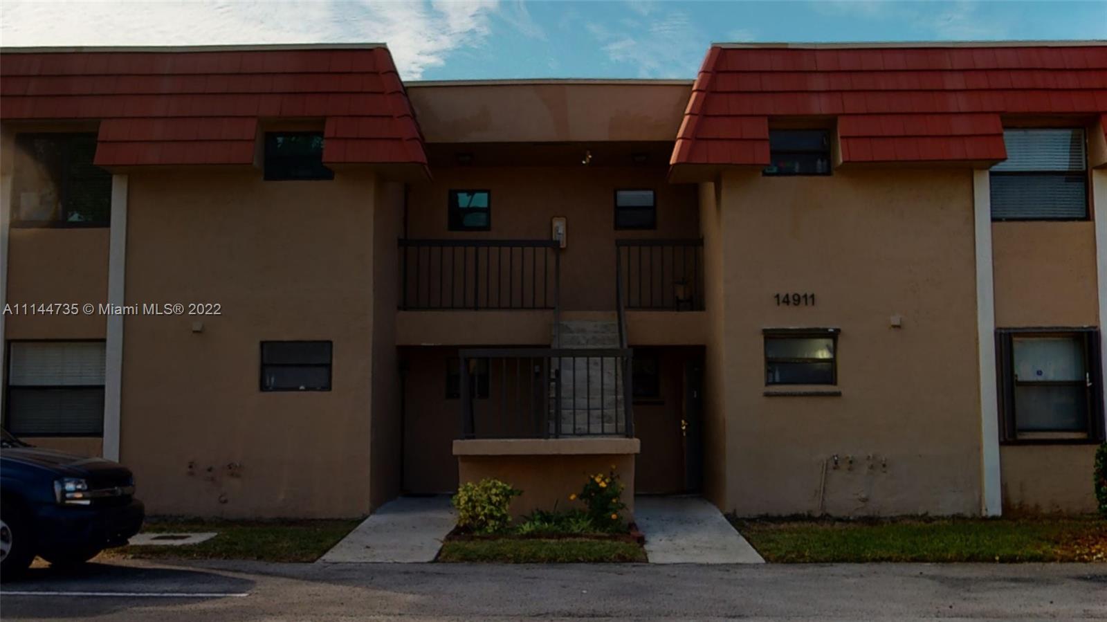 14911 Southwest 104th Street, Unit 1722 Miami, FL 33196 - Photo 5 of 29 a view of a house with large windows