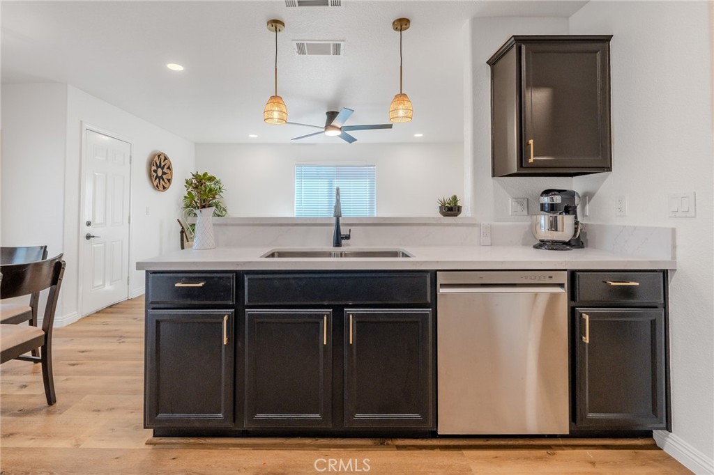 34634 Pso Del Valle Barstow, CA 92311 - Photo 5 of 37 a kitchen with a sink and a refrigerator
