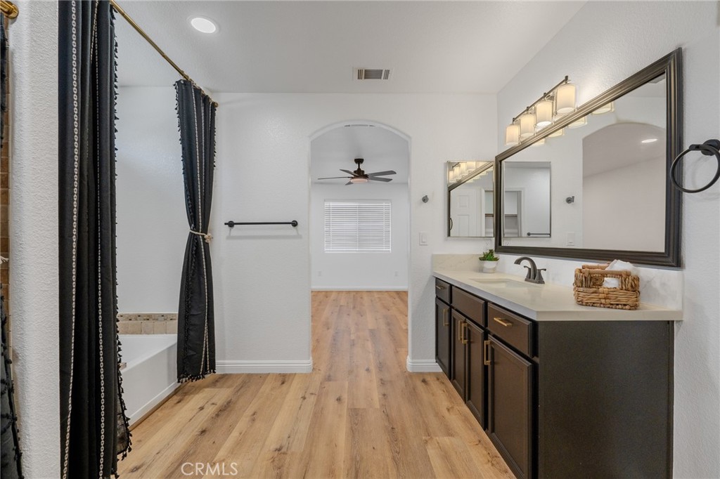 34634 Pso Del Valle Barstow, CA 92311 - Photo 8 of 37 a hallway view with wooden floor and electronic appliances
