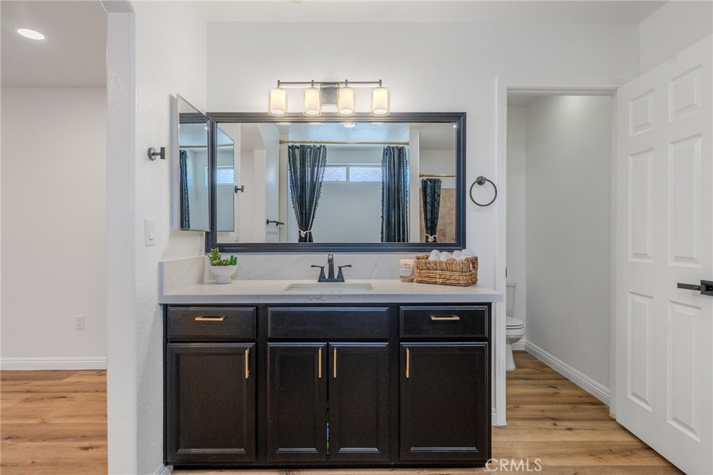 34634 Pso Del Valle Barstow, CA 92311 - Photo 9 of 37 a bathroom with a granite countertop sink a large mirror and a