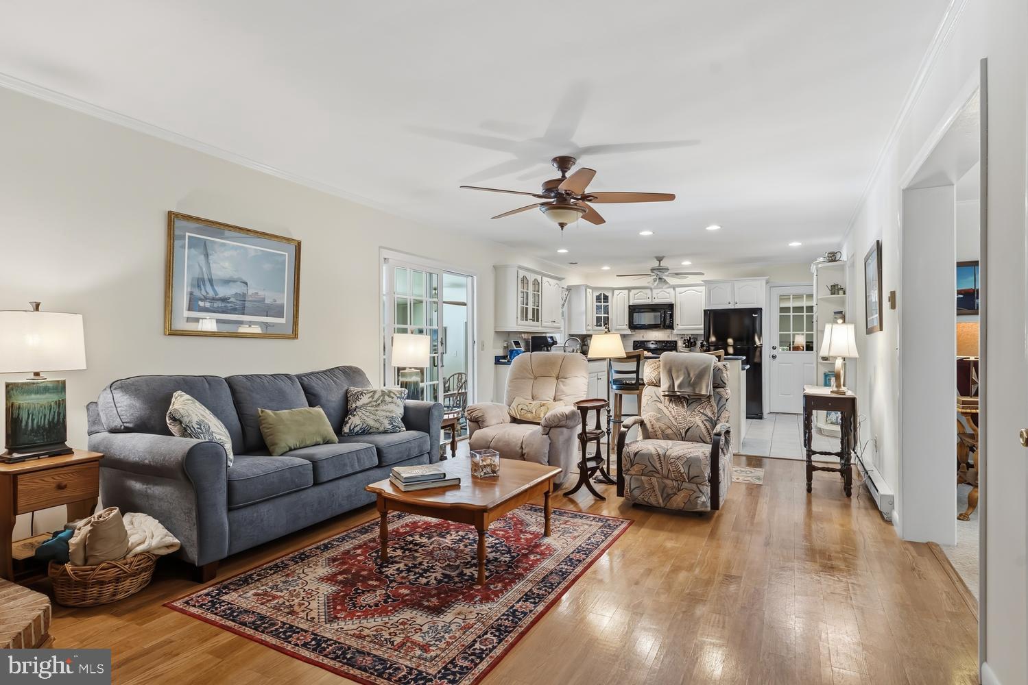 814 Wrights Neck Road Centreville, MD 21617 - Photo 34 of 53 a living room with furniture kitchen view and a chandelier