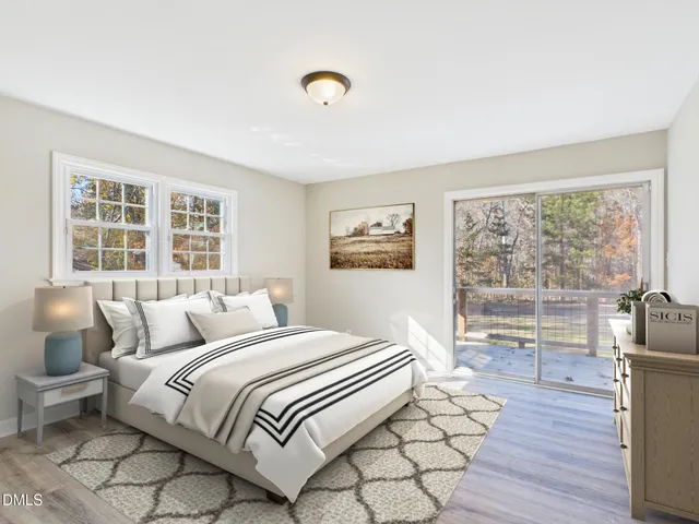 a bedroom with a large bed and a large window