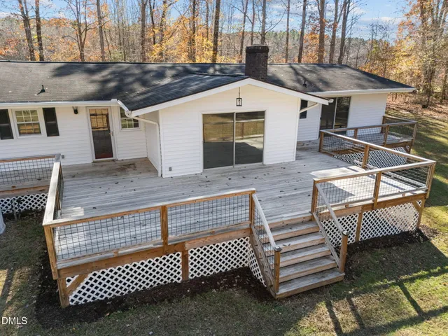 a view of a white house with a large window