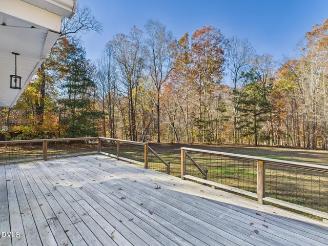 a view of outdoor space with deck and yard