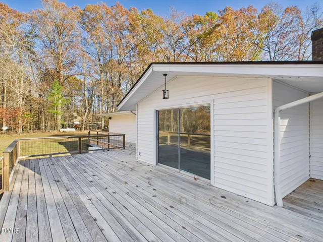 an outdoor view of house with wooden floor