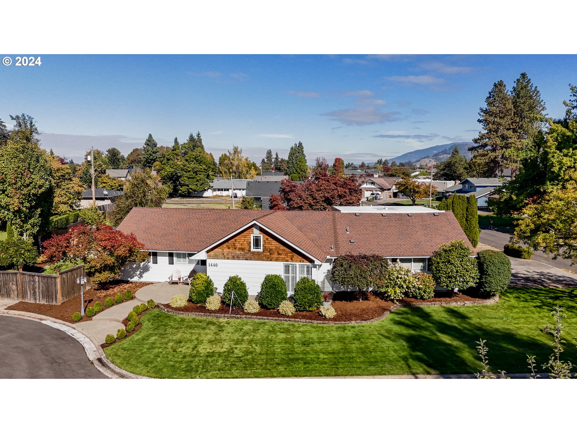 a view of houses with outdoor space and street view