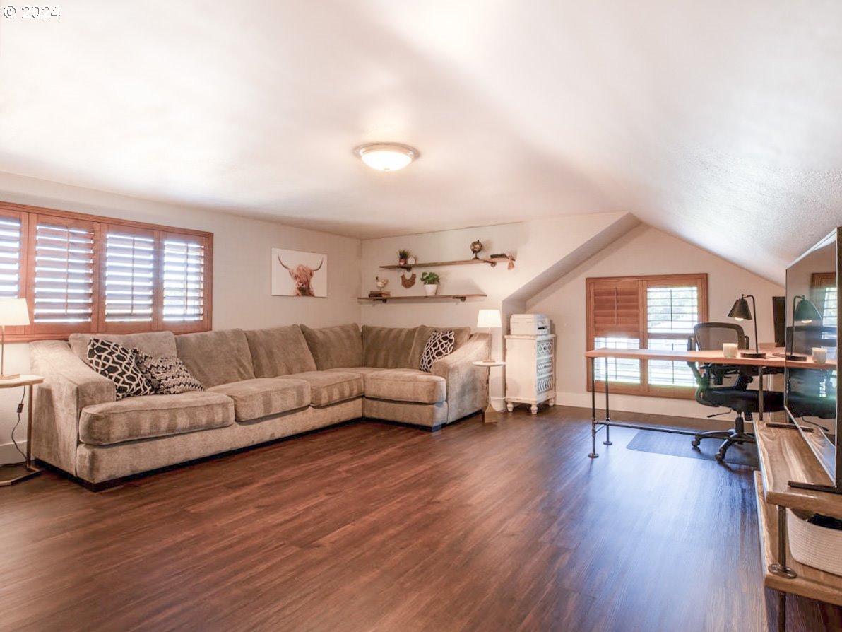 1440 Fetlock Court Eugene, OR 97401 - Photo 11 of 31 a living room with furniture and a wooden floor