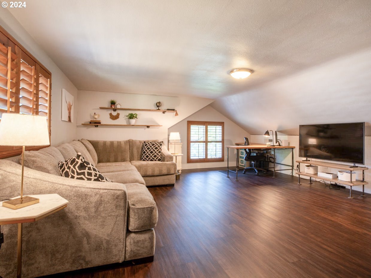 1440 Fetlock Court Eugene, OR 97401 - Photo 12 of 31 a living room with furniture and a flat screen tv