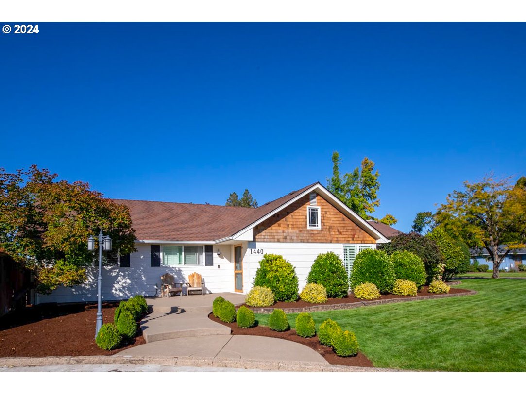 1440 Fetlock Court Eugene, OR 97401 - Photo 2 of 31 a view of a house with a yard and potted plants