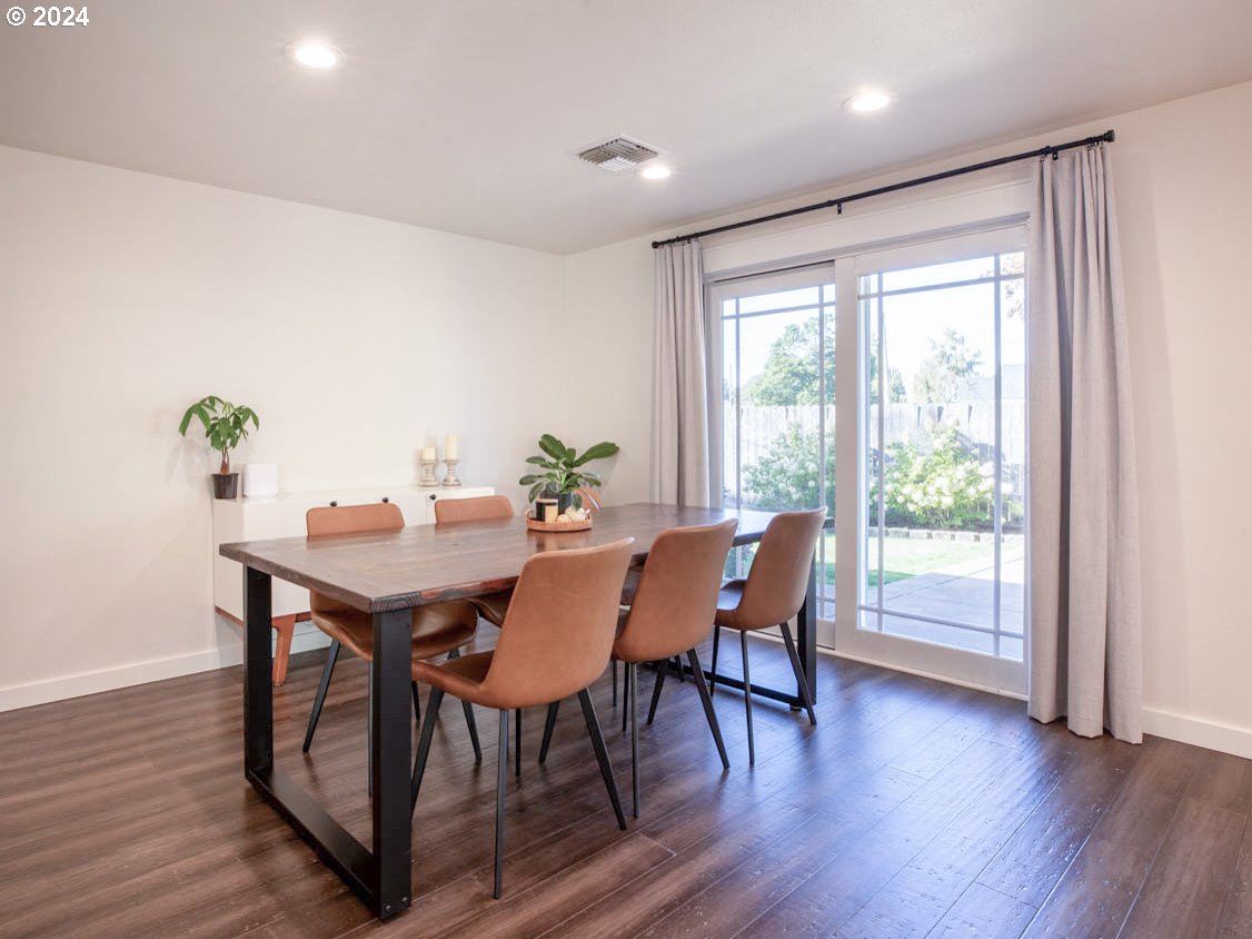 1440 Fetlock Court Eugene, OR 97401 - Photo 10 of 31 a view of a dining room with furniture window and wooden floor