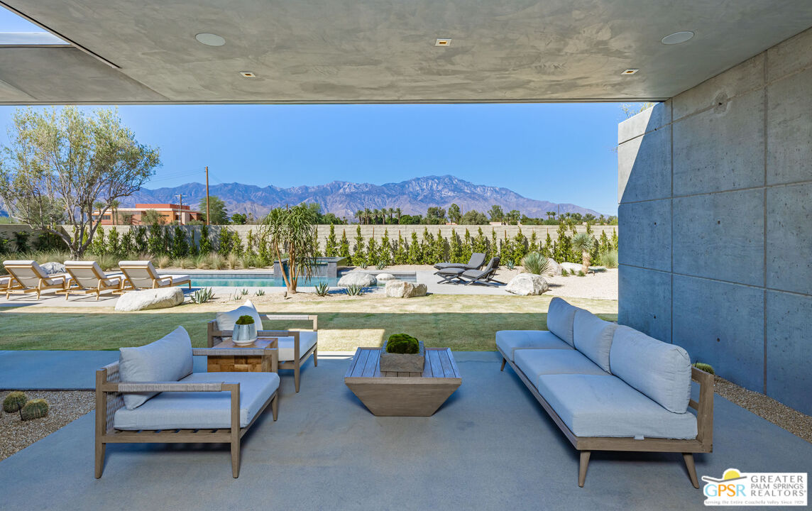 1 Echo Lane Rancho Mirage, CA 92270 - Photo 27 of 51 a view of swimming pool with outdoor seating and a potted plant