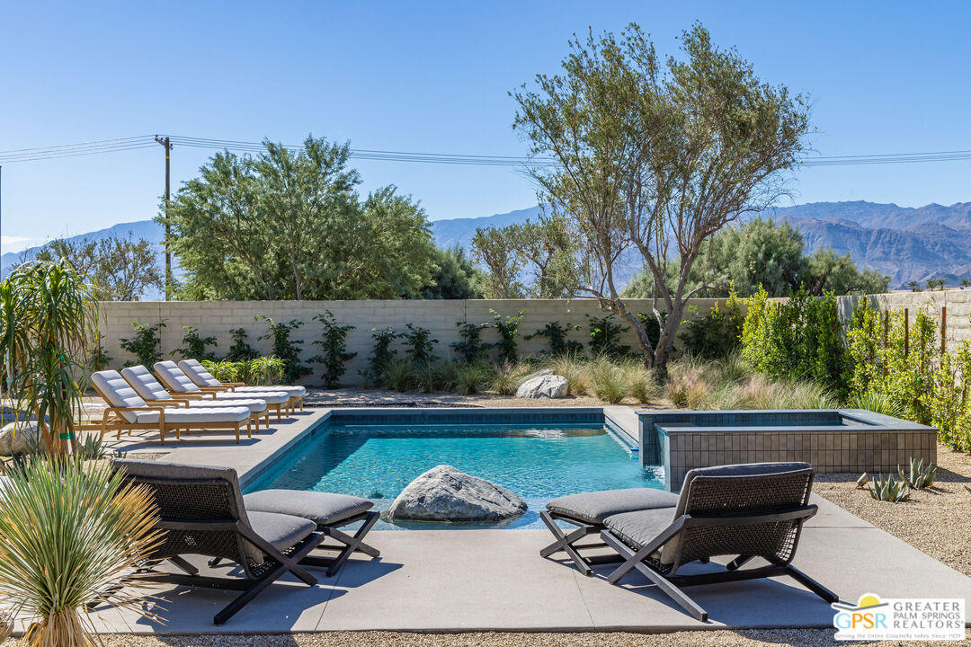 1 Echo Lane Rancho Mirage, CA 92270 - Photo 31 of 51 a view of a swimming pool with chairs