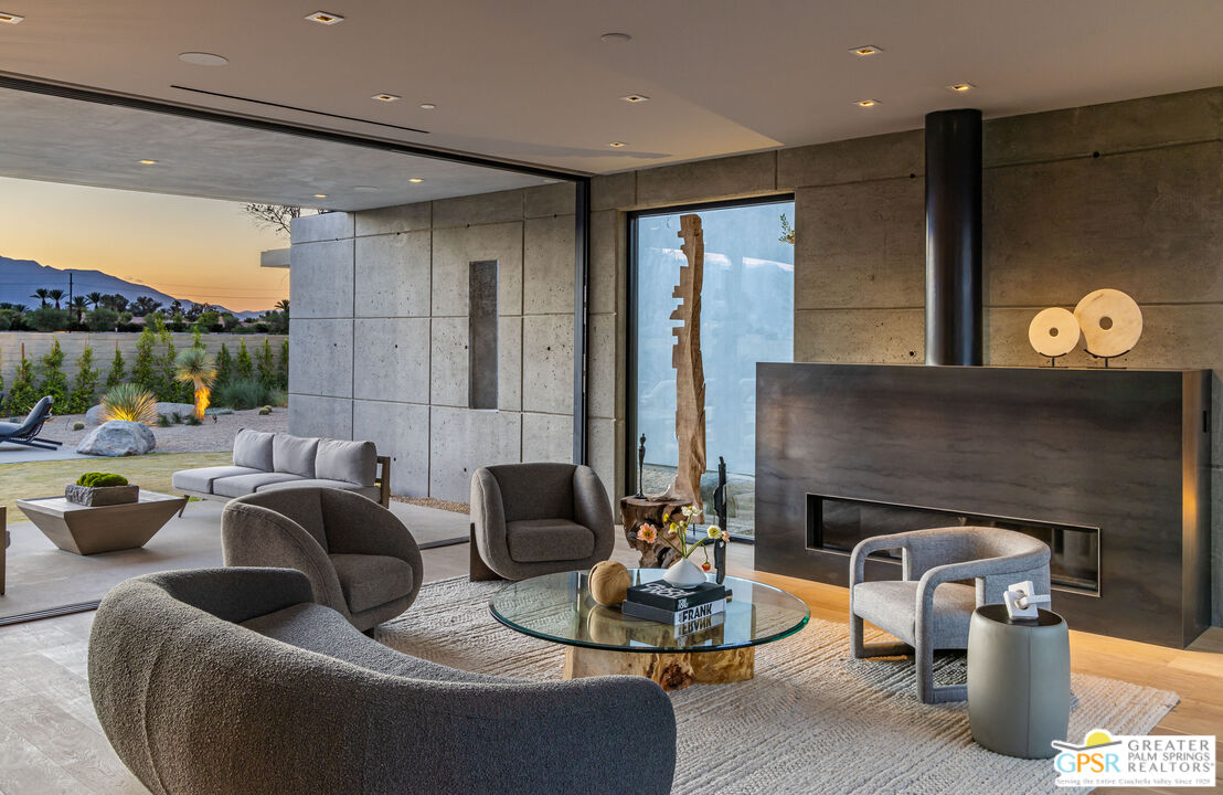 1 Echo Lane Rancho Mirage, CA 92270 - Photo 48 of 51 a living room with furniture and a fireplace