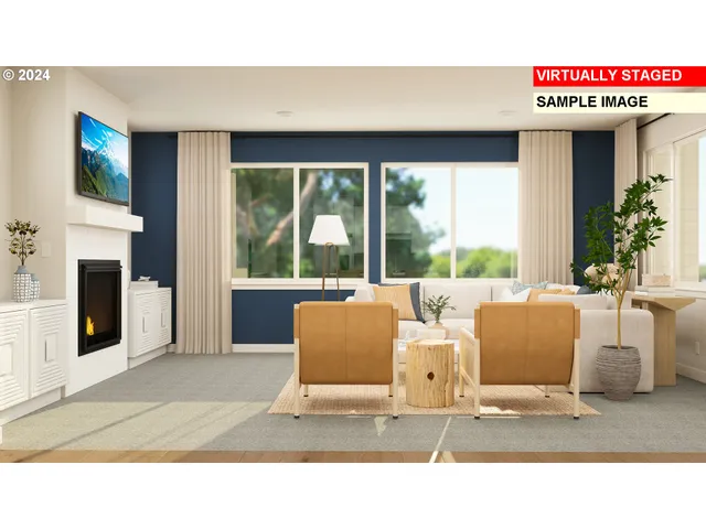 a living room with couches and a fireplace with large window