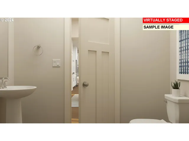 a bathroom with a sink a toilet a shower and a window