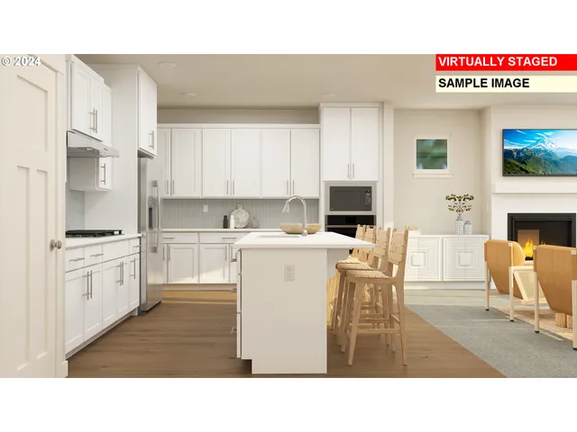 a kitchen with stainless steel appliances kitchen island granite countertop a table chairs sink and cabinets