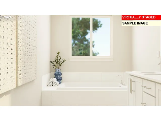 a picture of a bathroom with a bathtub