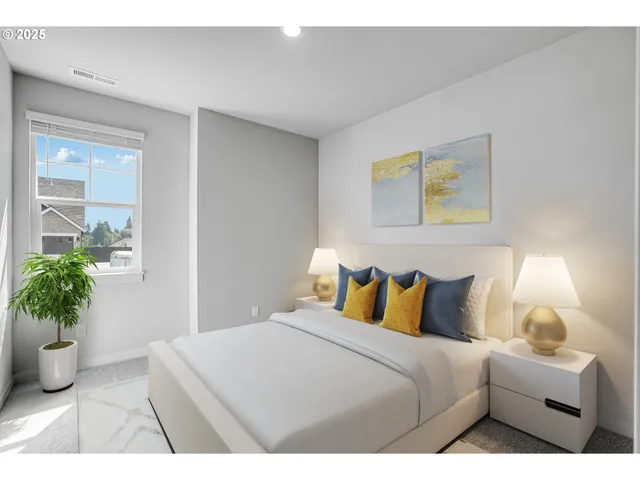 a bedroom with a bed and a potted plant