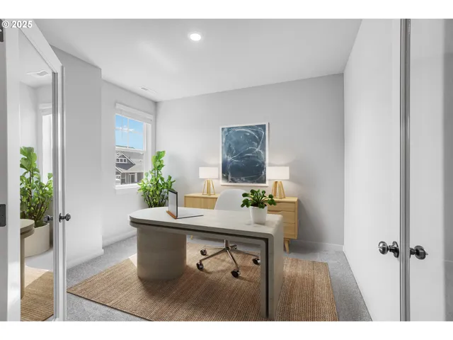 a dining room with a table and chairs