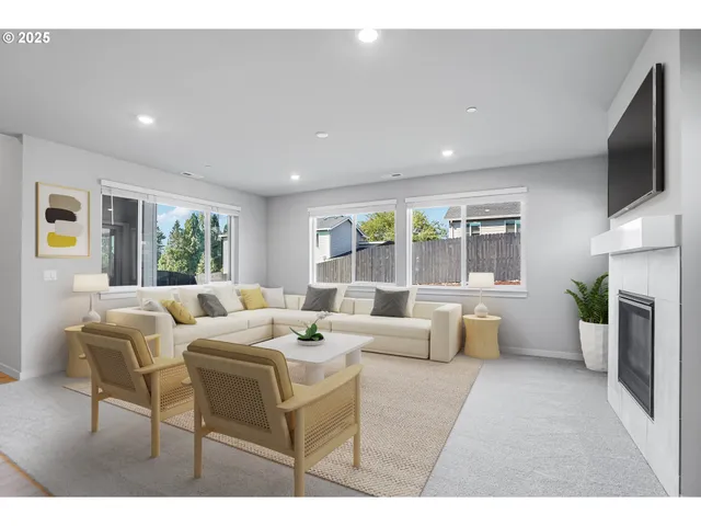 a living room with fireplace furniture and a flat screen tv