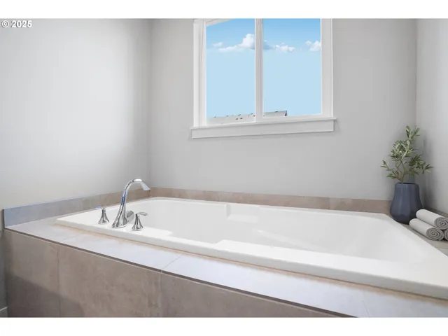 a bathroom with a bathtub and a sink