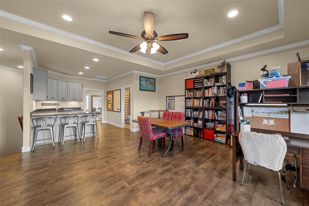 14690 Chapel Road Lorena, TX 76655 - Photo 23 of 40 a view of a dining room with furniture and wooden floor