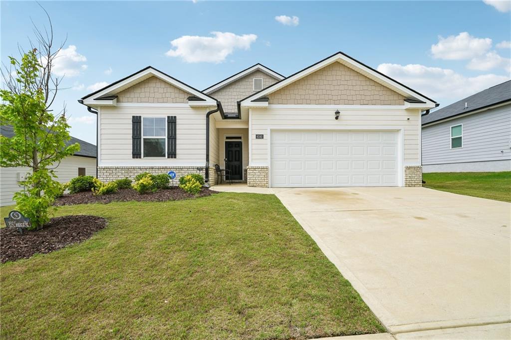 8592 Seabiscuit Road Lithonia, GA 30058 - Photo 1 of 25 a front view of house with yard and green space