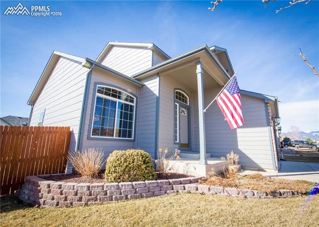 5427 Rondo Way Colorado Springs, CO 80911 - Photo 2 of 34 The front entry is covered. Notice the mountain views just beyond the home.