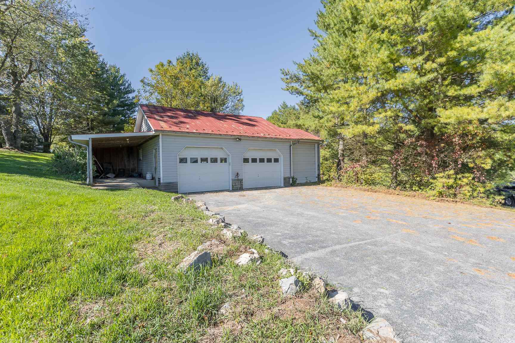 3756 Middlebrook Village Road Middlebrook, VA 24459 - Photo 4 of 41 a front view of a house with a yard and garage
