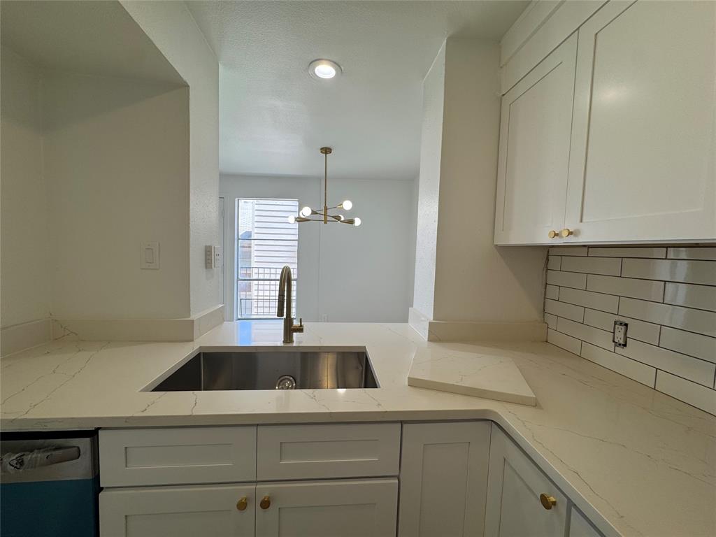 5510 Boca Raton Boulevard, Unit 431 Fort Worth, TX 76112 - Photo 8 of 19 a kitchen with a sink and cabinets