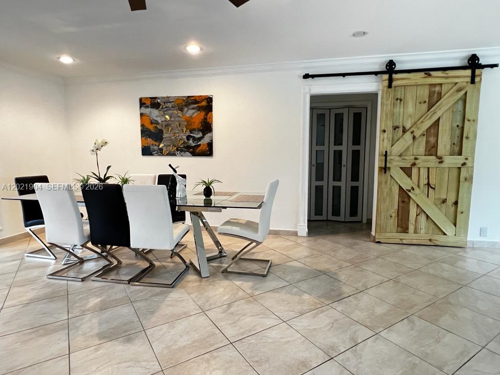 3324 Lakeview Boulevard Delray Beach, FL 33445 - Photo 8 of 36 a view of a workspace with furniture