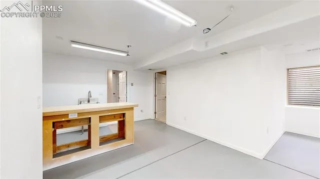 a kitchen with a stove top oven and sink