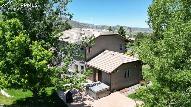 an aerial view of a house with a garden