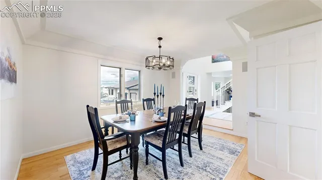 a view of a dining room with furniture and window