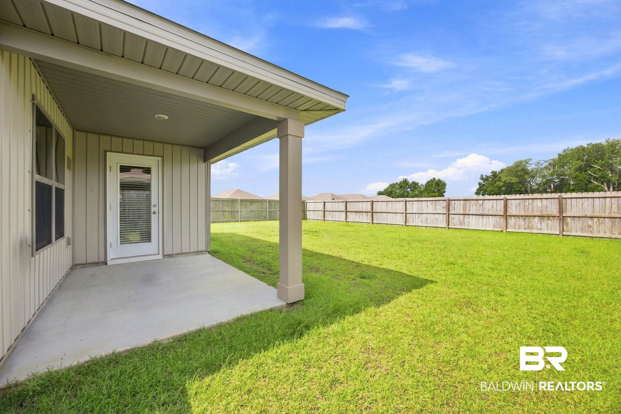 32155 Terranova Loop Lillian, AL 36549 - Photo 9 of 37 Expansive backyard featuring a manicured lawn and privacy fencing