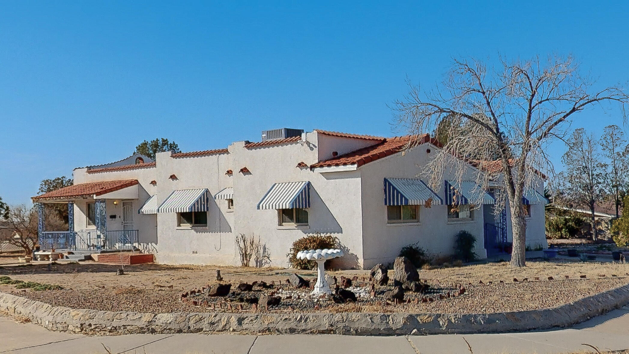 a view of a white house with a outdoor space
