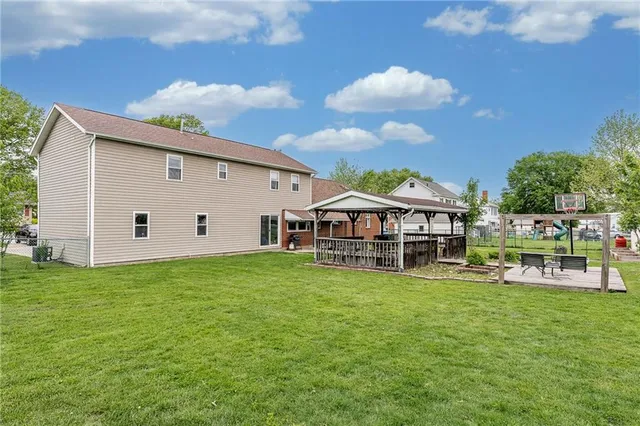 a view of a house with a yard porch and sitting area