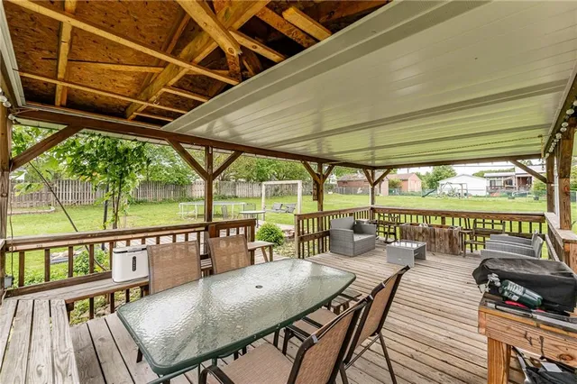 a view of a balcony with couch and wooden floor