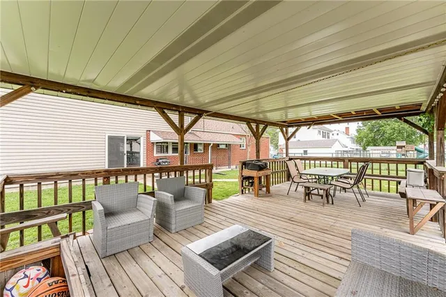 swimming pool view with a seating space
