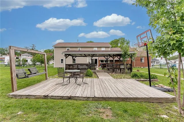 a view of a backyard with sitting area