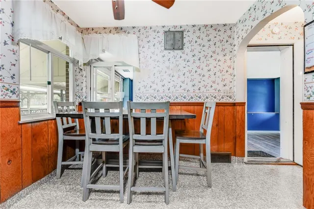 a dining room with furniture and window