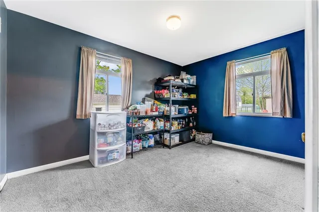 an empty room with toys and a window